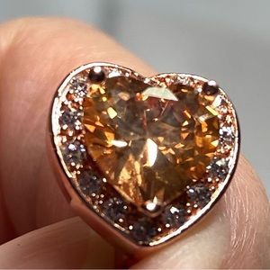 Earrings. Heart Shaped center stones. Surrounded with crystals.